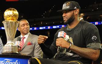 OAKLAND, CA - JUNE 19:  Matt Winer, Steve Smith, Grant Hill and Isiah Thomas interview LeBron James #23 of the Cleveland Cavaliers while he celebrates with the Larry O'Brien NBA Championship Trophy after winning Game Seven of the 2016 NBA Finals against the Golden State Warriors on June 19, 2016 at ORACLE Arena in Oakland, California. NOTE TO USER: User expressly acknowledges and agrees that, by downloading and/or using this Photograph, user is consenting to the terms and conditions of the Getty Images License Agreement. Mandatory Copyright Notice: Copyright 2016 NBAE (Photo by Andrew D. Bernstein/NBAE via Getty Images)