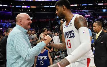 LOS ANGELES, CA - NOVEMBER 20: Paul George #13 of the Los Angeles Clippers is congratulated by owner owner Steve Ballmer after an overtime win over Boston Celtics, 107-104, at Staples Center on November 20, 2019 in Los Angeles, California. NOTE TO USER: User expressly acknowledges and agrees that, by downloading and/or using this Photograph, user is consenting to the terms and conditions of the Getty Images License Agreement. (Photo by Kevork Djansezian/Getty Images)