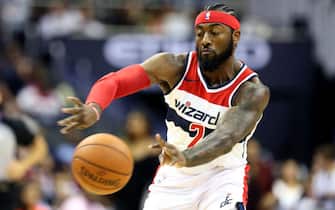 WASHINGTON, DC - OCTOBER 05: John Wall #2 of the Washington Wizards passes the ball against the Miami Heat during the second half of a preseason NBA game at Capital One Arena on October 5, 2018 in Washington, DC. NOTE TO USER: User expressly acknowledges and agrees that, by downloading and or using this photograph, User is consenting to the terms and conditions of the Getty Images License Agreement. (Photo by Will Newton/Getty Images)