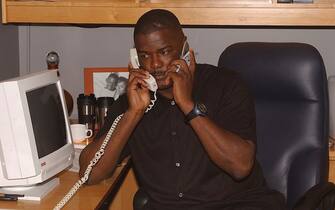 AUBURN HILLS, MI - JUNE 26: Detroit Pistons president Joe Dumars works the phones in the Pistons' war room during 2003 NBA Draft at the Palace of Auburn Hills June 26, 2003 in Auburn Hills, Michigan. NOTE TO USER: User expressly acknowledges and agrees that, by downloading and or using this photograph, User is consenting to the terms and conditions of the Getty Images License Agreement. (Photo by Allen Einstein/NBAE via Getty Images)