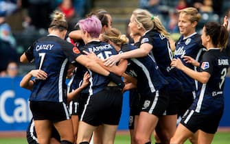 TACOMA, WA - SEPTEMBER 29:  Reign FC, including Steph Catley #7, Megan Rapinoe #15 and Allie Long #6 celebrate the goal by Jodie Taylor #9 against the Portland Thorns in the first half of the game at Cheney Stadium on September 29, 2019 in Tacoma, Washington. (Photo by Lindsey Wasson/Getty Images)