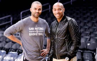 LOS ANGELES, CA - FEBRUARY 19:  Tony Parker #9 of the San Antonio Spurs poses for a photo with soccer player Thierry Henry prior to the game against the Los Angeles Lakers on February 19, 2016 at the Staples Center in Los Angeles, California . NOTE TO USER: User expressly acknowledges and agrees that, by downloading and/or using this Photograph, user is consenting to the terms and conditions of the Getty Images License Agreement. Mandatory Copyright Notice: Copyright 2016 NBAE (Photo by Chris Elise/NBAE via Getty Images)