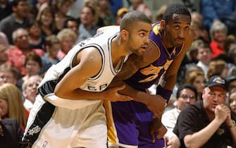 SAN ANTONIO - MAY 13:  Tony Parker #9 of the San Antonio Spurs defends Kobe Bryant #8 of the Los Angeles Lakers in Game five of the Western Conference Semifinals during the 2004 NBA Playoffs at Staples Center on May 13, 2004 in San Antonio, Texas.  The Lakers won 74-73.  NOTE TO USER: User expressly acknowledges and agrees that, by downloading and/or using this Photograph, user is consenting to the terms and conditions of the Getty Images License Agreement.  Mandatory Copyright Notice: Copyright 2004 NBAE (Photo by Andrew D. Bernstein/NBAE via Getty Images)