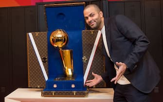 PARIS, FRANCE - JANUARY 22:  NBA Legend, Tony Parker poses for a photo next to the Louis Vuitton trunk for the Larry O'Brien Trophy during the Louis Vuitton Announcement Party as part of NBA Paris Games 2020 on January 22, 2020 in Paris, France at LVMH Headquarters. NOTE TO USER: User expressly acknowledges and agrees that, by downloading and/or using this Photograph, user is consenting to the terms and conditions of the Getty Images License Agreement. Mandatory Copyright Notice: Copyright 2020 NBAE (Photo by Alain Gadoffre/NBAE via Getty Images)