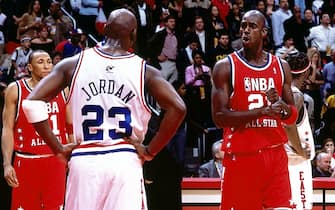 1781275 ATLANTA - FEBRUARY 9: Kevin Garnett #21 of the Western Conference All Stars talks with Michael Jordan #23 of the Eastern Conference All Stars during the 2003 NBA All-Star Game at the Phillips Arena on February 9, 2003 in Atlanta, Georgia. The West won 155-145 in the first ever double-overtime All-Star Game. NOTE TO USER: User expressly acknowledges and agrees that, by downloading and/or using this Photograph, User is consenting to the terms and conditions of the Getty Images License Agreement. Mandatory Copyright Notice: Copyright 2003 NBAE (Photo by Andrew D. Bernstein/NBAE via Getty Images)