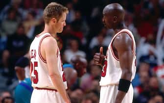CHICAGO - MAY 3:  Michael Jordan #23 of the Chicago Bulls talks to Steve Kerr #25 of the Chicago Bulls during a game played on May 3, 1998 at the United Center in Chicago, Illinois.  NOTE TO USER: User expressly acknowledges and agrees that, by downloading and or using this photograph, User is consenting to the terms and conditions of the Getty Images License Agreement. Mandatory Copyright Notice: Copyright 1998 NBAE  (Photo by Nathaniel S. Butler/NBAE via Getty Images)