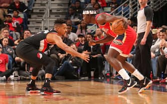 NEW ORLEANS, LA - NOVEMBER 19: CJ McCollum #3 of the Portland Trail Blazers plays defense against Jrue Holiday #11 of the New Orleans Pelicans on November 19, 2019 at Smoothie King Center in New Orleans, Louisiana. NOTE TO USER: User expressly acknowledges and agrees that, by downloading and/or using this photograph, User is consenting to the terms and conditions of the Getty Images License Agreement. Mandatory Copyright Notice: Copyright 2019 NBAE (Photo by Layne Murdoch Jr./NBAE via Getty Images)
