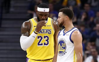 SAN FRANCISCO, CALIFORNIA - OCTOBER 05:  LeBron James #23 of the Los Angeles Lakers talks to Stephen Curry #30 of the Golden State Warriors during their game at Chase Center on October 05, 2019 in San Francisco, California.  NOTE TO USER: User expressly acknowledges and agrees that, by downloading and or using this photograph, User is consenting to the terms and conditions of the Getty Images License Agreement.  (Photo by Ezra Shaw/Getty Images)