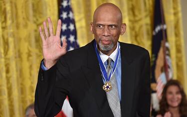 Former NBA basketball player Kareem Abdul Jabbar waves after being presented with the Presidential Medal of Freedom by US President Barack Obama, the nation's highest civilian honor, during a ceremony honoring 21 recipients, in the East Room of the White House in Washington, DC, November 22, 2016. / AFP / Nicholas Kamm        (Photo credit should read NICHOLAS KAMM/AFP via Getty Images)