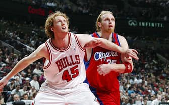 57218601 CHICAGO - MARCH 10: Luke Schenscher #45 of the Chicago Bulls battles for position against Chris Kaman #35 of the Los Angeles Clippers on March 10, 2006 at the United Center in Chicago, Illinois. The Bulls won 107-96. NOTE TO USER: User expressly acknowledges and agrees that, by downloading and/or using this Photograph, User is consenting to the terms and conditions of the Getty Images License Agreement. Mandatory copyright notice: Copyright 2006 NBAE (Photo by Gary Dineen/NBAE via Getty Images) *** Local Caption *** Luke Schenscher;Chris Kaman