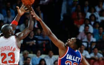 CHICAGO, IL - CIRCA 1990:  Michael Jordan #23 of the Chicago Bulls shoots over John Salley #22 of the Detroit Pistons during an NBA basketball game circa 1990 at the Chicago Stadium in Chicago, Illinois. Salley played for the Pistons from 1986-92. (Photo by Focus on Sport/Getty Images) *** Local Caption *** John Salley; Michael Jordan