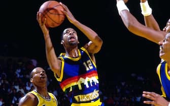 INGLEWOOD, CA - CIRCA 1987: Fat Lever #12 of the Denver Nuggets shoots against Byron Scott #4 of the Los Angeles Lakers circa 1987 at the Great Western Forum in Inglewood, California. NOTE TO USER: User expressly acknowledges and agrees that, by downloading and or using this photograph, User is consenting to the terms and conditions of the Getty Images License Agreement. Mandatory Copyright Notice: Copyright 1987 NBAE (Photo by Andrew D. Bernstein/NBAE via Getty Images)