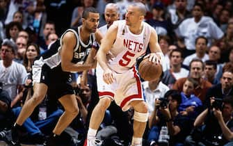 EAST RUTHERFORD, NJ - JUNE 13:  Jason Kidd #5 of the New Jersey Nets posts up against Tony Parker #9 of the San Antonio Spurs during Game five of the NBA Finals at Continental Airlines Arena on June 13, 2003 in East Rutherford, New Jersey.  The Spurs won 93-83.  NOTE TO USER: User expressly acknowledges and agrees that, by downloading and/or using this Photograph, User is consenting to the terms and conditions of the Getty Images License Agreement  Copyright 2003 NBAE  (Photo by Nathaniel S. Butler/NBAEvia Getty Images) 