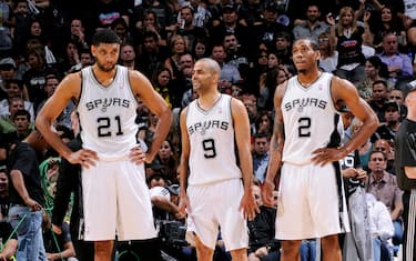 SAN ANTONIO, TX - MAY 14: Tim Duncan #21, Tony Parker #9, and Kawhi Leonard #2 of the San Antonio Spurs stand on the court during a game against the Portland Trail Blazers in Game Five of the Western Conference Semifinals between the San Antonio Spurs and the Portland Trail Blazers during the 2014 NBA Playoffs on May 14, 2014 at the AT&T Center in San Antonio, Texas. NOTE TO USER: User expressly acknowledges and agrees that, by downloading and/or using this Photograph, user is consenting to the terms and conditions of the Getty Images License Agreement. Mandatory Copyright Notice: Copyright 2013 NBAE (Photo by D. Clarke Evans/NBAE via Getty Images)