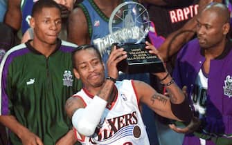 WASHINGTON, :  Philadelphia 76ers' guard Allen Iverson (C) stands with his fellow NBA All-Stars and holds his MVP trophy for his performance in the 2001 NBA All-Star Game 11 February 2001 at the MCI Center in Washington, DC.        AFP Photo/Mario TAMA (Photo credit should read MARIO TAMA/AFP via Getty Images)
