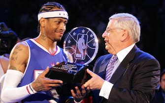 DENVER, UNITED STATES:  NBA Commissioner David Stern (R) hands Allen Iverson of the Eastern Conference team the All-Star Most Valuable Player (MVP) trophy after the NBA All-Star game 20 February 2005 in Denver. The East defeated the West 125-115.     AFP PHOTO/Don EMMERT  (Photo credit should read DON EMMERT/AFP via Getty Images)