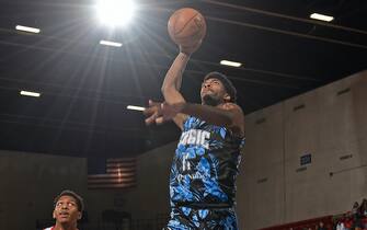 LAKELAND, FL - MARCH 10:  Amile Jefferson #11 of the Lakeland Magic drives to the basket against the Erie BayHawks on March 10, 2020 at the RP Funding Center in Lakeland, Florida. NOTE TO USER: User expressly acknowledges and agrees that, by downloading and or using this photograph, User is consenting to the terms and conditions of the Getty Images License Agreement. Mandatory Copyright Notice: Copyright 2020 NBAE (Photo by Gary Bassing/NBAE via Getty Images)
