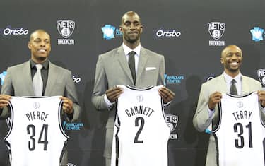 BROOKLYN, NY - July 18: Kevin Garnett #2, Paul Pierce #34, and Jason Terry #31 of the Brooklyn Nets pose with their new jerseys during a press conference at the Barclays Center on July 18, 2013 in the Brooklyn borough of New York City.  NOTE TO USER: User expressly acknowledges and agrees that, by downloading and/or using this Photograph, user is consenting to the terms and conditions of the Getty Images License Agreement. Mandatory Copyright Notice: Copyright 2013 NBAE (Photo by Nathaniel S. Butler/NBAE via Getty Images)