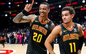 ATLANTA, GA - JANUARY 14: John Collins #20 stands with Trae Young #11 of the Atlanta Hawks following a game against the Phoenix Suns at State Farm Arena on January 14, 2020 in Atlanta, Georgia. NOTE TO USER: User expressly acknowledges and agrees that, by downloading and or using this photograph, User is consenting to the terms and conditions of the Getty Images License Agreement. (Photo by Carmen Mandato/Getty Images)