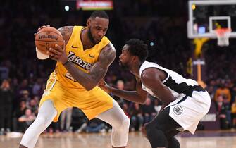 LOS ANGELES, CA - DECEMBER 25: Patrick Beverley #21 of the Los Angeles Clippers guards LeBron James #23 of the Los Angeles Lakers in the second half of the game at Staples Center on December 25, 2019 in Los Angeles, California. NOTE TO USER: User expressly acknowledges and agrees that, by downloading and/or using this Photograph, user is consenting to the terms and conditions of the Getty Images License Agreement. (Photo by Jayne Kamin-Oncea/Getty Images)