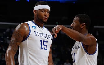 NEW ORLEANS - MARCH 18:  DeMarcus Cousins #15 and John Wall #11 of the Kentucky Wildcats talk during the game against the East Tennessee State Buccaneers during the first round of the 2010 NCAA men's basketball tournament at the New Orleans Arena on March 18, 2010 in New Orleans, Louisiana.  (Photo by Chris Graythen/Getty Images)