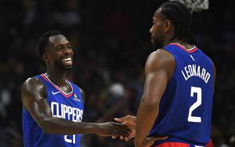 LOS ANGELES, CALIFORNIA - OCTOBER 22:   Patrick Beverley #21 of the LA Clippers laughs with Kawhi Leonard #2 leading the Los Angeles Lakers during the fourth quarter in a 112-102 Clippers win in the LA Clippers season home opener at Staples Center on October 22, 2019 in Los Angeles, California. (Photo by Harry How/Getty Images)