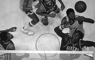 (Original Caption) Darryl Dawkins (53) of the Philadelphia 76ers, and Earvin "Magic" Johnson (32) go up for a rebound late in game two of the NBA Championship series at the Forum 5/7. Dawkins led the 76ers with 25 points to help them beat the Lakers 104-107 to tie the series 1-1. "Magic" Johnson came in two points behind Dawkins with 23 points.