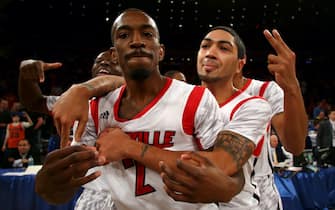 NEW YORK, NY - MARCH 16:  (L-R) Russ Smith #2 and Peyton Siva #3 of the Louisville Cardinals celebrate after they won 78-61 against the Syracuse Orange during the final of the Big East Men's Basketball Tournament at Madison Square Garden on March 16, 2013 in New York City.  (Photo by Elsa/Getty Images)