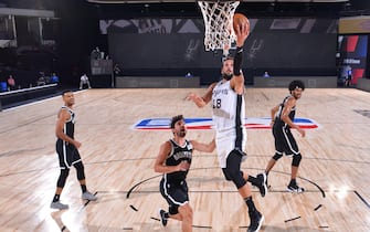 ORLANDO, FL - JULY 25: Marco Belinelli #18 of the San Antonio Spurs shoots the ball against the Brooklyn Nets on July 25, 2020 at The Arena at ESPN Wide World of Sports Complex in Orlando, Florida. NOTE TO USER: User expressly acknowledges and agrees that, by downloading and or using this photograph, User is consenting to the terms and conditions of the Getty Images License Agreement. Mandatory Copyright Notice: Copyright 2020 NBAE (Photo by Jesse D. Garrabrant/NBAE via Getty Images)