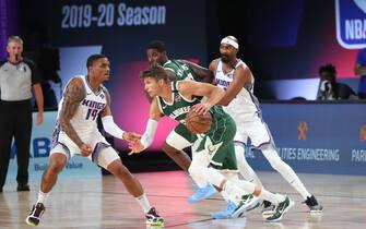 Orlando, FL - JULY 25: Kyle Korver #26 of the Milwaukee Bucks handles the ball against the Sacramento Kings during a scrimmage on July 25, 2020 at The Arena at ESPN Wide World of Sports in Orlando, Florida. NOTE TO USER: User expressly acknowledges and agrees that, by downloading and/or using this Photograph, user is consenting to the terms and conditions of the Getty Images License Agreement. Mandatory Copyright Notice: Copyright 2020 NBAE (Photo by Joe Murphy/NBAE via Getty Images)
