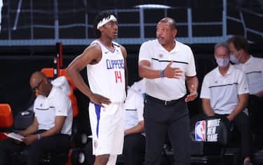 ORLANDO, FL - JULY 22: Head coach Doc Rivers of the LA Clippers talks with Terance Mann #14 of the LA Clippers during the game on July 22, 2020 at The Arena at ESPN Wide World of Sports Complex in Orlando, Florida. NOTE TO USER: User expressly acknowledges and agrees that, by downloading and or using this photograph, User is consenting to the terms and conditions of the Getty Images License Agreement. Mandatory Copyright Notice: Copyright 2020 NBAE (Photo by Joe Murphy/NBAE via Getty Images)