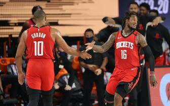 1227795874 Orlando, FL - JULY 26: Eric Gordon #10 of the Houston Rockets high-fives Ben McLemore #16 of the Houston Rockets during a scrimmage on July 26, 2020 at HP Field House at ESPN Wide World of Sports in Orlando, Florida. NOTE TO USER: User expressly acknowledges and agrees that, by downloading and/or using this Photograph, user is consenting to the terms and conditions of the Getty Images License Agreement. Mandatory Copyright Notice: Copyright 2020 NBAE (Photo by Joe Murphy/NBAE via Getty Images)