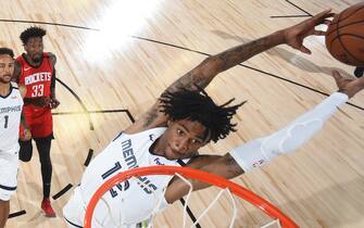 Orlando, FL - JULY 26: Ja Morant #12 of the Memphis Grizzlies dunks the ball against the Houston Rockets during a scrimmage on July 26, 2020 at HP Field House at ESPN Wide World of Sports in Orlando, Florida. NOTE TO USER: User expressly acknowledges and agrees that, by downloading and/or using this Photograph, user is consenting to the terms and conditions of the Getty Images License Agreement. Mandatory Copyright Notice: Copyright 2020 NBAE (Photo by Joe Murphy/NBAE via Getty Images)