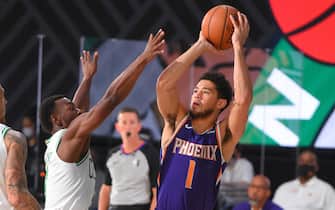 Orlando, FL - JULY 26: Devin Booker #1 of the Phoenix Suns shoots the ball against the Boston Celtics during a scrimmage on July 26, 2020 at HP Field House at ESPN Wide World of Sports in Orlando, Florida. NOTE TO USER: User expressly acknowledges and agrees that, by downloading and/or using this Photograph, user is consenting to the terms and conditions of the Getty Images License Agreement. Mandatory Copyright Notice: Copyright 2020 NBAE (Photo by Bill Baptist/NBAE via Getty Images)