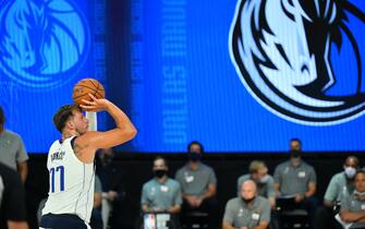 Orlando, FL - JULY 26: Luka Doncic #77 of the Dallas Mavericks shoots a free-throw during a scrimmage against the Indiana Pacers on July 26, 2020 at HP Field House at ESPN Wide World of Sports in Orlando, Florida. NOTE TO USER: User expressly acknowledges and agrees that, by downloading and/or using this Photograph, user is consenting to the terms and conditions of the Getty Images License Agreement. Mandatory Copyright Notice: Copyright 2020 NBAE (Photo by Jesse D. Garrabrant/NBAE via Getty Images)