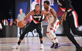 ORLANDO, FL - JULY 26: CJ McCollum #3 of the Portland Trail Blazers dribbles the ball against the Toronto Raptors on July 26, 2020 in Orlando, Florida at Visa Athletic Center at ESPN Wide World of Sports. NOTE TO USER: User expressly acknowledges and agrees that, by downloading and/or using this photograph, user is consenting to the terms and conditions of the Getty Images License Agreement. Mandatory Copyright Notice: Copyright 2020 NBAE (Photo by David Dow/NBAE via Getty Images)