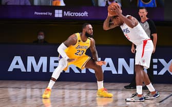 Orlando, FL - JULY 30: LeBron James #23 of the Los Angeles Lakers plays defense against Kawhi Leonard #2 of the LA Clippers on July 30, 2020 at The Arena at ESPN Wide World Of Sports Complex in Orlando, Florida. NOTE TO USER: User expressly acknowledges and agrees that, by downloading and/or using this Photograph, user is consenting to the terms and conditions of the Getty Images License Agreement. Mandatory Copyright Notice: Copyright 2020 NBAE (Photo by Jesse D. Garrabrant/NBAE via Getty Images)