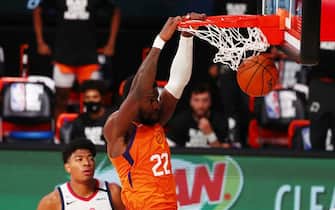 LAKE BUENA VISTA, FLORIDA - JULY 31: Deandre Ayton #22 of the Phoenix Suns dunks the ball as Rui Hachimura #8 of the Washington Wizards looks on in the second half of an NBA basketball game at ESPN Wide World Of Sports Complex on July 31, 2020 in Lake Buena Vista, Florida. NOTE TO USER: User expressly acknowledges and agrees that, by downloading and or using this photograph, User is consenting to the terms and conditions of the Getty Images License Agreement. (Photo by Kim Klement - Pool/Getty Images)