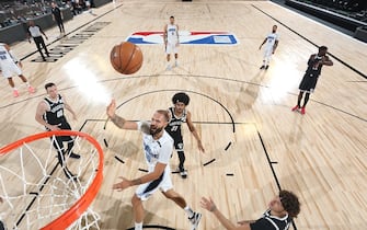 Orlando, FL - JULY 31:  Evan Fournier #10 of the Orlando Magic shoots the ball against the Brooklyn Nets during a scrimmage on July 31, 2020 at HP Field House at ESPN Wide World of Sports in Orlando, Florida. NOTE TO USER: User expressly acknowledges and agrees that, by downloading and/or using this Photograph, user is consenting to the terms and conditions of the Getty Images License Agreement. Mandatory Copyright Notice: Copyright 2020 NBAE (Photo by David Sherman/NBAE via Getty Images)
