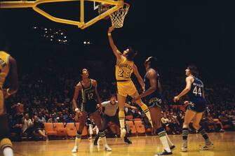 (Original Caption) Inglewood, California: Gail Goodrich (25) of the Los Angeles Lakers putting in a layup during a game against the Atlanta Hawks. Los Angeles won 104-95.