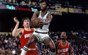 BOSTON - UNDATED:  Nate Archibald #7 of the Boston Celtics drives to the basket against the Houston Rockets during an NBA game circa 1978-1983 at the Boston Garden in Boston, Massachusetts.  NOTE TO USER: User expressly acknowledges that, by downloading and or using this photograph, User is consenting to the terms and conditions of the Getty Images License agreement. Mandatory Copyright Notice: Copyright 1978 NBAE (Photo by Dick Raphael/NBAE via Getty Images)