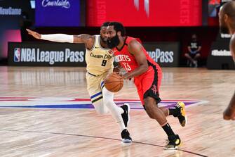 Orlando, FL - AUGUST 2: James Harden #13 of the Houston Rockets handles the ball against the Milwaukee Bucks on August 2, 2020 at The Arena at ESPN Wide World Of Sports Complex in Orlando, Florida. NOTE TO USER: User expressly acknowledges and agrees that, by downloading and/or using this Photograph, user is consenting to the terms and conditions of the Getty Images License Agreement. Mandatory Copyright Notice: Copyright 2020 NBAE (Photo by Jesse D. Garrabrant/NBAE via Getty Images)