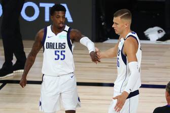 LAKE BUENA VISTA, FLORIDA - AUGUST 04: Kristaps Porzingis #6 of the Dallas Mavericks celebrates with guard Delon Wright #55 after scoring against the Sacramento Kings in the first half of a NBA basketball game  at HP Field House at ESPN Wide World Of Sports Complex on August 4, 2020 in Lake Buena Vista, Florida. NOTE TO USER: User expressly acknowledges and agrees that, by downloading and or using this photograph, User is consenting to the terms and conditions of the Getty Images License Agreement. (Photo by Kim Klement-Pool/Getty Images)