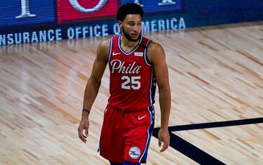 Philadelphia 76ers guard Ben Simmons (25) walks up the court during the first half of an NBA basketball game against the Washington Wizards Wednesday, Aug. 5, 2020 in Lake Buena Vista, Fla. (AP Photo/Ashley Landis)