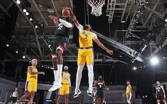 ORLANDO, FL - AUGUST 06: Anthony Davis #3 of the Los Angeles Lakers blocks the shot of Jeff Green #32 of the Houston Rockets on August 6, 2020 in Orlando, Florida at The Arena at ESPN Wide World of Sports. NOTE TO USER: User expressly acknowledges and agrees that, by downloading and/or using this photograph, user is consenting to the terms and conditions of the Getty Images License Agreement. Mandatory Copyright Notice: Copyright 2020 NBAE (Photo by Bill Baptist/NBAE via Getty Images)