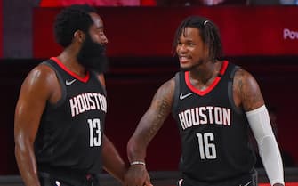 ORLANDO, FL - AUGUST 06: James Harden #13 and Ben McLemore #16 of the Houston Rockets smile and shake hands against the Los Angeles Lakers on August 6, 2020 in Orlando, Florida at The Arena at ESPN Wide World of Sports. NOTE TO USER: User expressly acknowledges and agrees that, by downloading and/or using this photograph, user is consenting to the terms and conditions of the Getty Images License Agreement. Mandatory Copyright Notice: Copyright 2020 NBAE (Photo by Bill Baptist/NBAE via Getty Images)