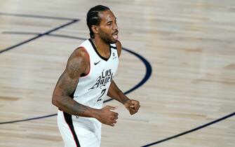 Los Angeles Clippers' Kawhi Leonard (2) reacts after making a three-point shot against the Dallas Mavericks during the second half of an NBA basketball game Thursday, Aug. 6, 2020 in Lake Buena Vista, Fla. The Clippers won 126-111. (AP Photo/Ashley Landis, Pool)