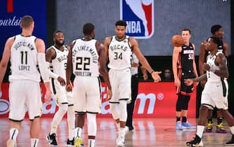 ORLANDO, FL - AUGUST 6: Giannis Antetokounmpo #34 of the Milwaukee Bucks high-fives teammates during the game on August 6, 2020 at The Arena at ESPN Wide World of Sports in Orlando, Florida. NOTE TO USER: User expressly acknowledges and agrees that, by downloading and/or using this Photograph, user is consenting to the terms and conditions of the Getty Images License Agreement. Mandatory Copyright Notice: Copyright 2020 NBAE (Photo by Jesse D. Garrabrant/NBAE via Getty Images)
