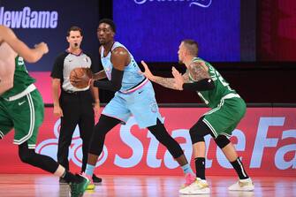 Orlando, FL - AUGUST 4: Bam Adebayo #13 of the Miami Heat handles the ball against the Boston Celtics on August 4, 2020 at HP Field House at ESPN Wide World of Sports in Orlando, Florida. NOTE TO USER: User expressly acknowledges and agrees that, by downloading and/or using this Photograph, user is consenting to the terms and conditions of the Getty Images License Agreement. Mandatory Copyright Notice: Copyright 2020 NBAE (Photo by Garrett Ellwood/NBAE via Getty Images)