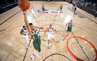 ORLANDO, FL - AUGUST 08: Giannis Antetokounmpo #34 of the Milwaukee Bucks dunks the ball against the Dallas Mavericks on August 8, 2020 in Orlando, Florida at AdventHealth Arena. NOTE TO USER: User expressly acknowledges and agrees that, by downloading and/or using this photograph, user is consenting to the terms and conditions of the Getty Images License Agreement. Mandatory Copyright Notice: Copyright 2020 NBAE (Photo by Garrett Ellwood/NBAE via Getty Images)